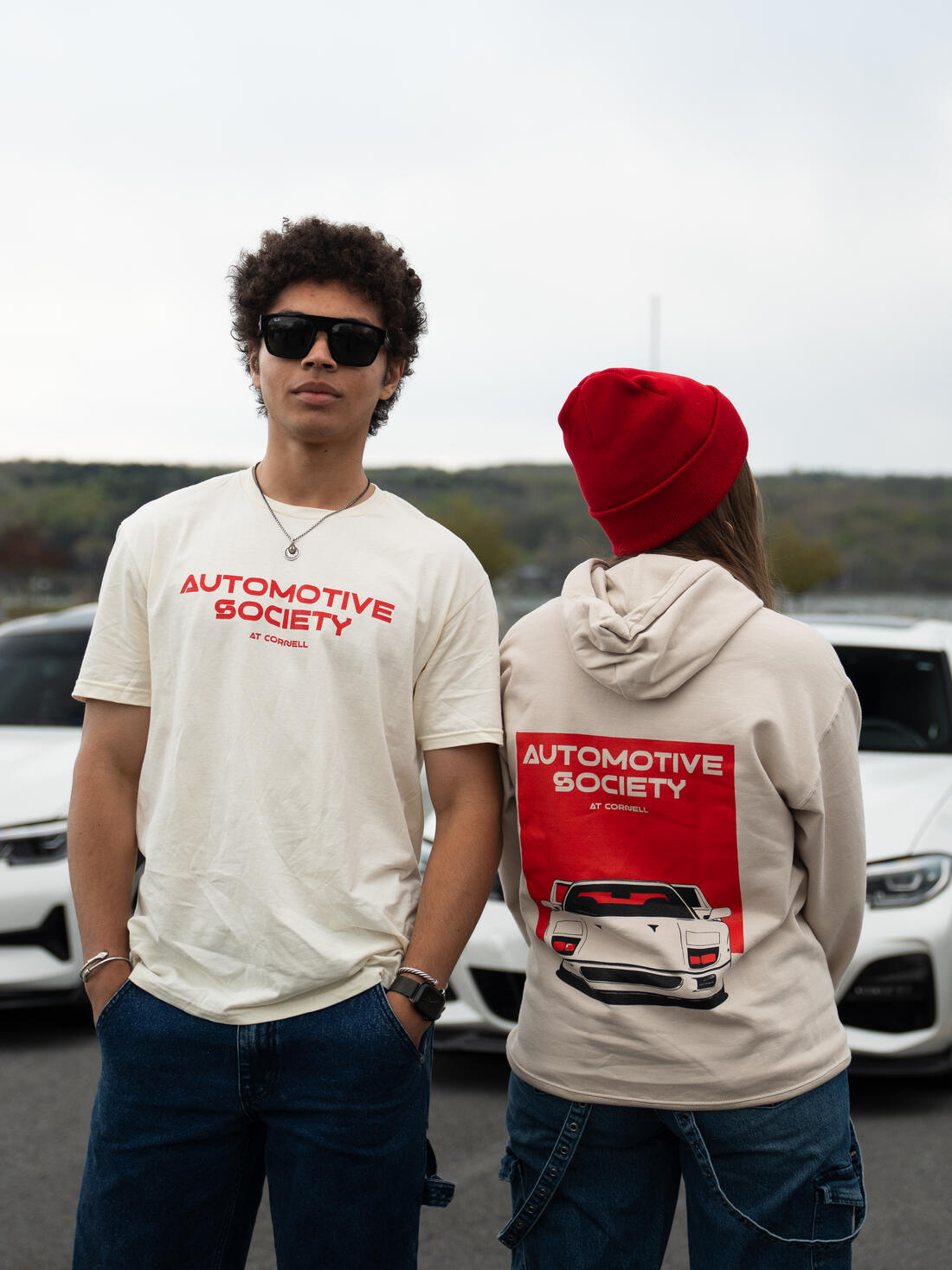 Two members wearing Automotive Society at Cornell merch